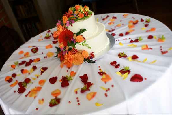 Autumn colored Wedding cake topper floral cascade and table petals