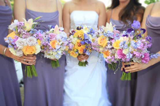 The Bride carried lady's slipper orchids, calla lilies, columbines, roses, 