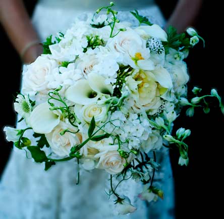  lacey gown was reflected in her airy all white and cream Summer bouquet 