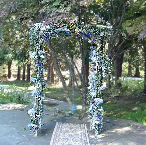 The ceremonial arch was decorated with blue hydrangea eucalyptus